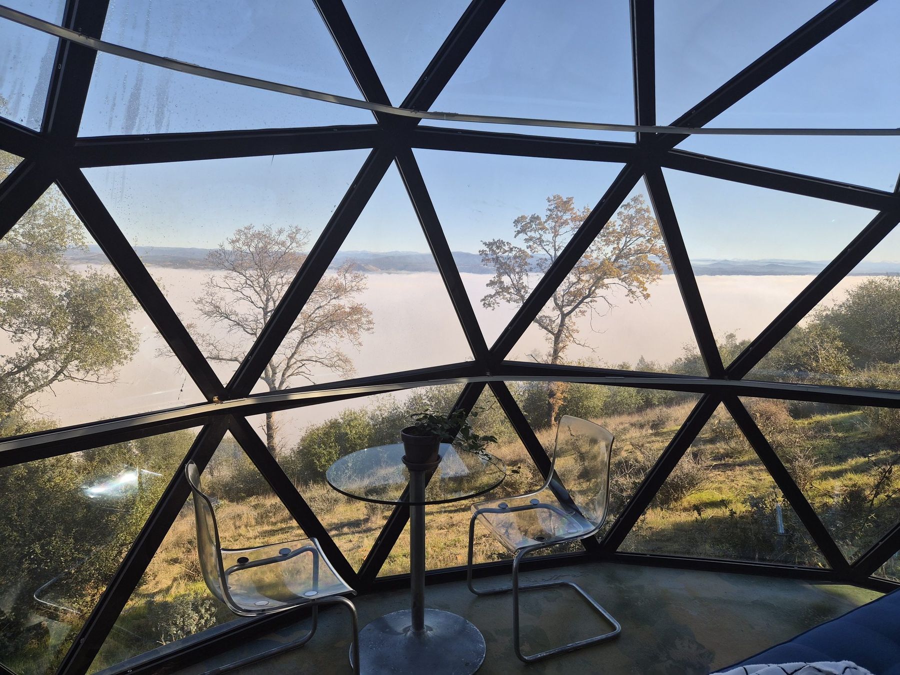 The glass dome above a sea of morning fog